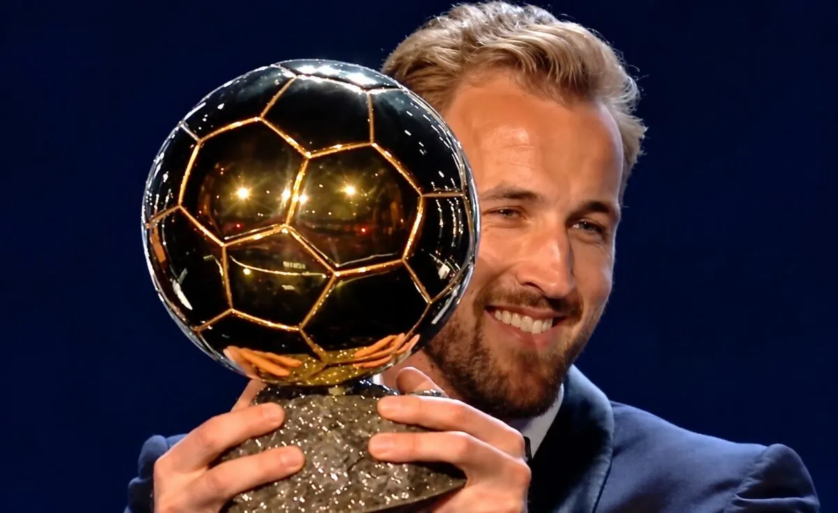 Harry Kane holding up Ballon d'Or trophy after winning in 2026 ceremony