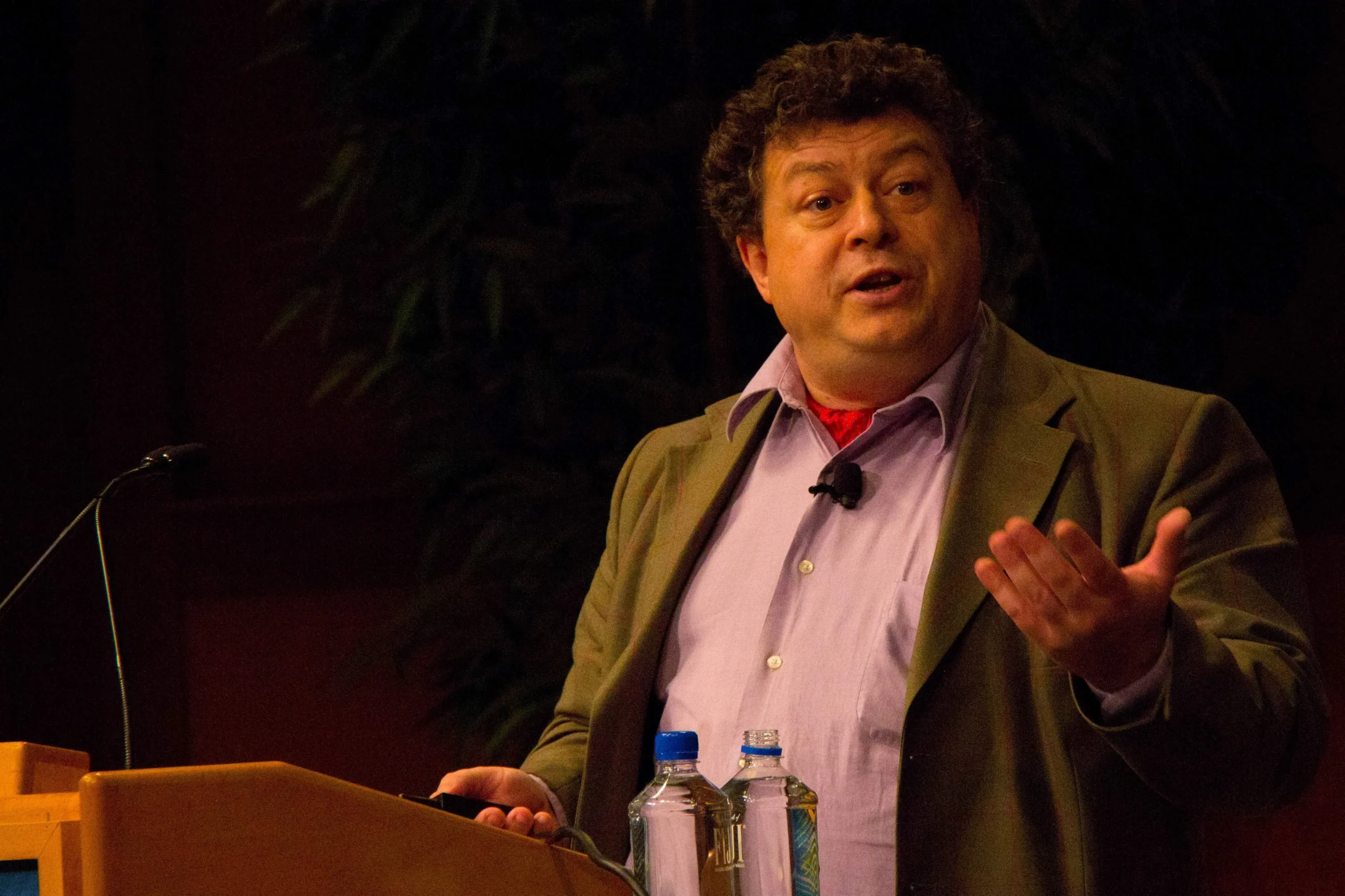 Rory Sutherland speaking at event on stage