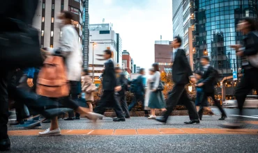 business people travelling on their way to work through city environment