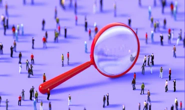 Human crowd surrounding a red magnifier object on purple background. Vertical  composition with copy space.